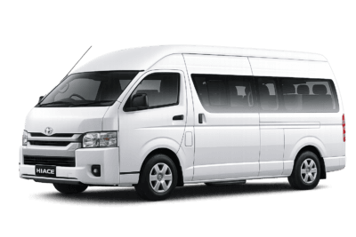 Toyota Hiace Commuter putih tampak serong depan dan samping untuk layanan sewa Hiace Bandung dengan driver profesional