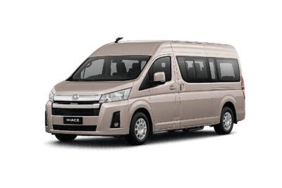 Toyota Hiace Premio coklat muda metallic tampak serong depan dan samping untuk layanan sewa Hiace Bandung dengan driver profesional