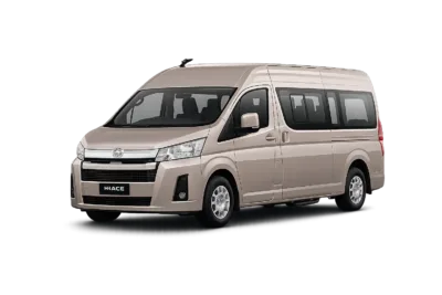 Toyota Hiace Premio coklat muda metallic tampak serong depan dan samping untuk layanan sewa Hiace Tangerang dengan driver profesional