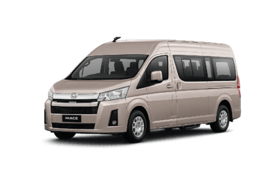 Toyota Hiace Premio Luxury coklat muda metallic tampak serong depan dan samping untuk layanan sewa Hiace Luxury Tangerang dengan driver profesional